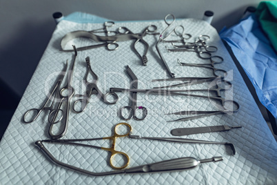 Surgical instruments arranged on table in operating room