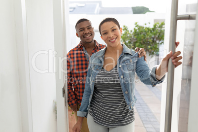 Happy Couple entering their house
