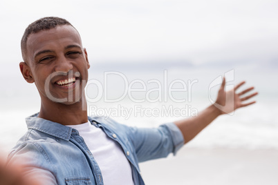 Man smiling at beach on a sunny day