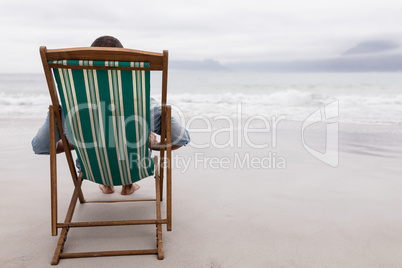 Man relaxing on a beach chair at beach