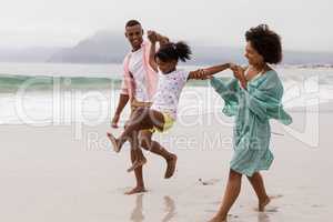 Family having fun together on the beach