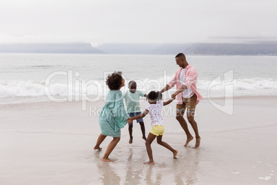 Family having fun on the beach