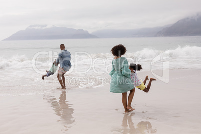 Family having fun together on the beach