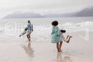 Family having fun together on the beach