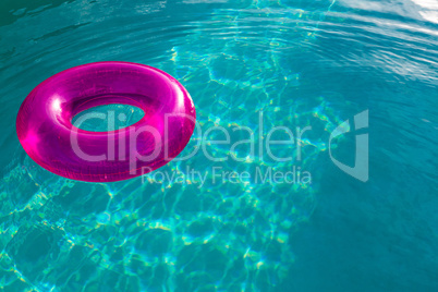 Inflatable tube floating in a swimming pool in backyard