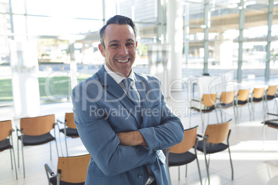 Businessman standing in conference room