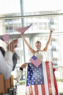 Young Caucasian businesswoman doing speech to business people in conference room during meeting