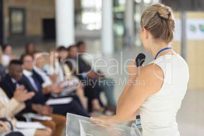 Caucasian businesswoman doing a speech in conference room