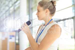 Young Caucasian businesswoman doing a speech in conference room