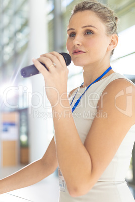 Young Caucasian businesswoman doing a speech in conference room