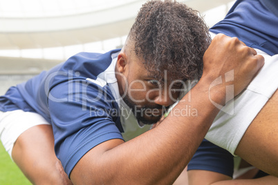 African American male rugby players ready to play rugby match in stadium