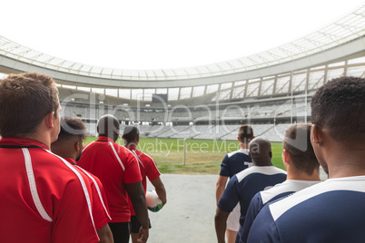 Rugby teams standing in a row at the entrance of stadium for match