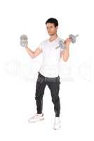 Young man standing and exercising with two dumbbells