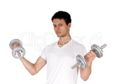 Close up of a young man exercising with two dumbbells