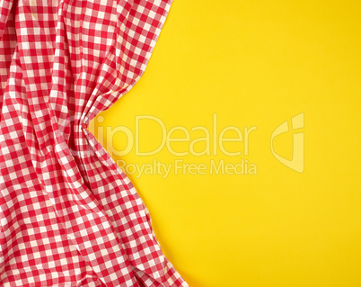 white red checkered kitchen towel on a yellow background