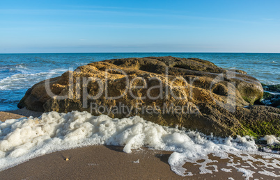 Big Limestone rock on the seashore