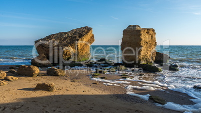 Several huge limestone stones by the sea