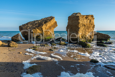 Several huge limestone stones by the sea