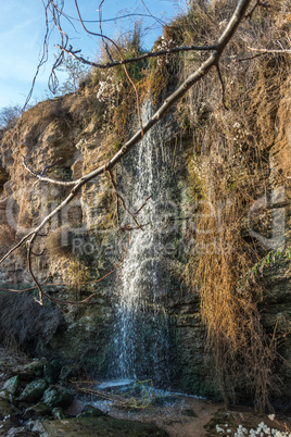 Stream and a small waterfall near the sea