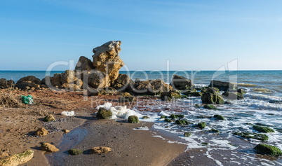 A scattering of large stones by the sea