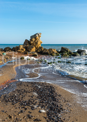 A scattering of large stones by the sea