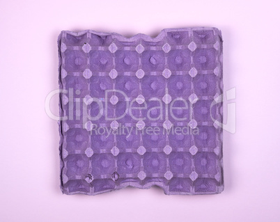 purple protective tray for raw chicken eggs with cells