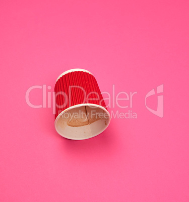 used paper red cup with corrugated edges from the coffee