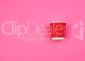 red paper cup with corrugated edges for hot drinks