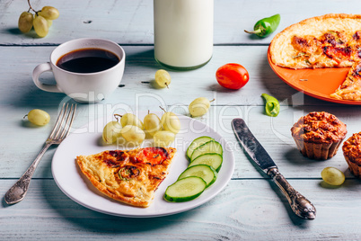 Frittata with with coffee, grapes and muffins.
