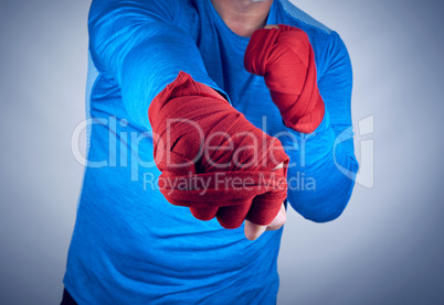 athlete in a blue dress standing in a combat sport aggressive st