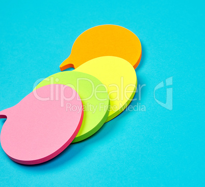 stack of multicolored empty paper stickers in the form of clouds