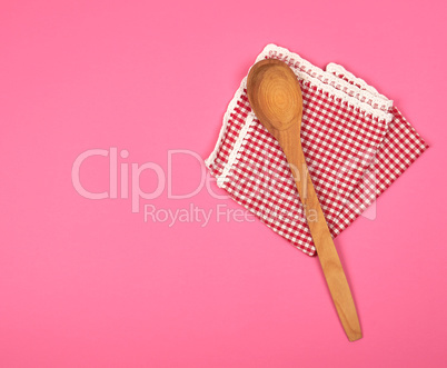 wooden spoon on a red kitchen towel