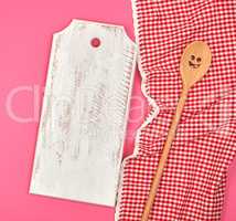 white wooden cutting board and wooden spoon