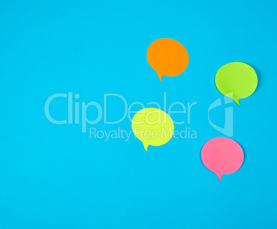 color paper stickers on a blue background, close up