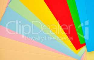 laid out bright multicolored paper, abstract background
