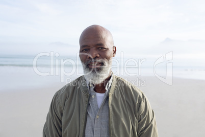African-American man smiling by the beach