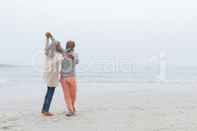 Couple dancing at the beach