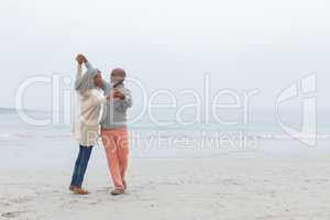 Couple dancing at the beach