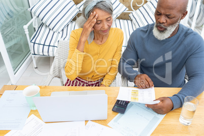 Couple calculating finances