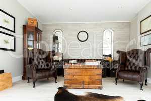 Classic room with leather chairs and wooden table
