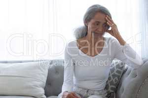 Woman sitting on couch