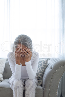 Woman sitting on couch