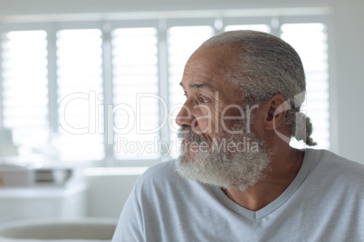 Man looking serious inside white room