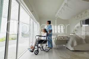 Healthcare worker and woman on a wheelchair
