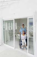 Healthcare worker and woman on a wheelchair