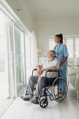 Healthcare worker and man on wheelchair