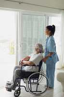Healthcare worker with man on wheelchair