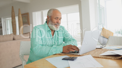 Man using laptop on table