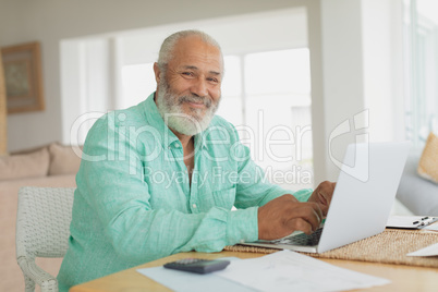 Man using laptop on a table