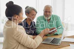 Financial adviser discussing information with a couple